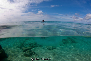 Getting ready for beach dive in Bonaire by Jim Garber 